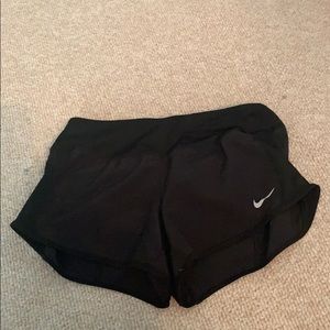 Black Nike running shorts